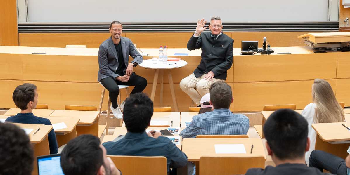Joel Roos and Chris Luebkeman talking to the attendends